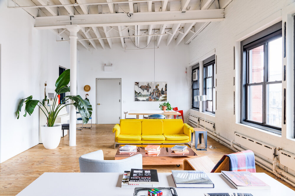 casa janka event space with custom furniture, large windows, and natural light in chinatown manhattan
