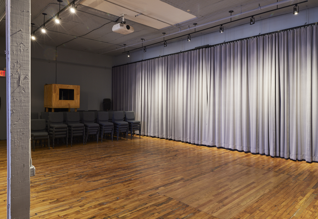 03 Casa Kino Event Space with Open Floor Plan, Hanging Curtain, and Projector 03 Casa Kino Event Space with Open Floor Plan, Hanging Curtain, and Projector