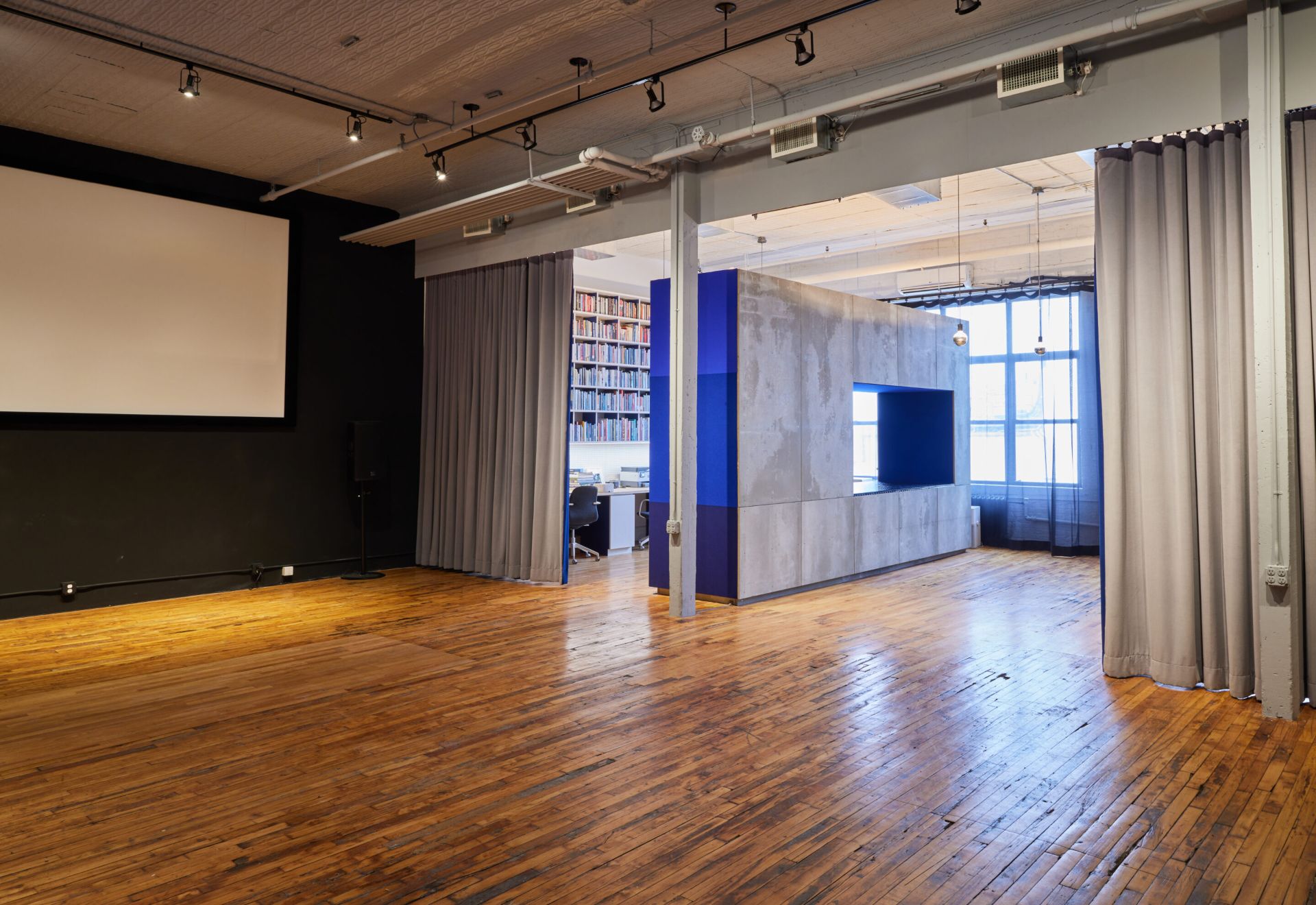 Casa Maxima event space with hanging curtain divider Casa Maxima event space with hanging curtain divider