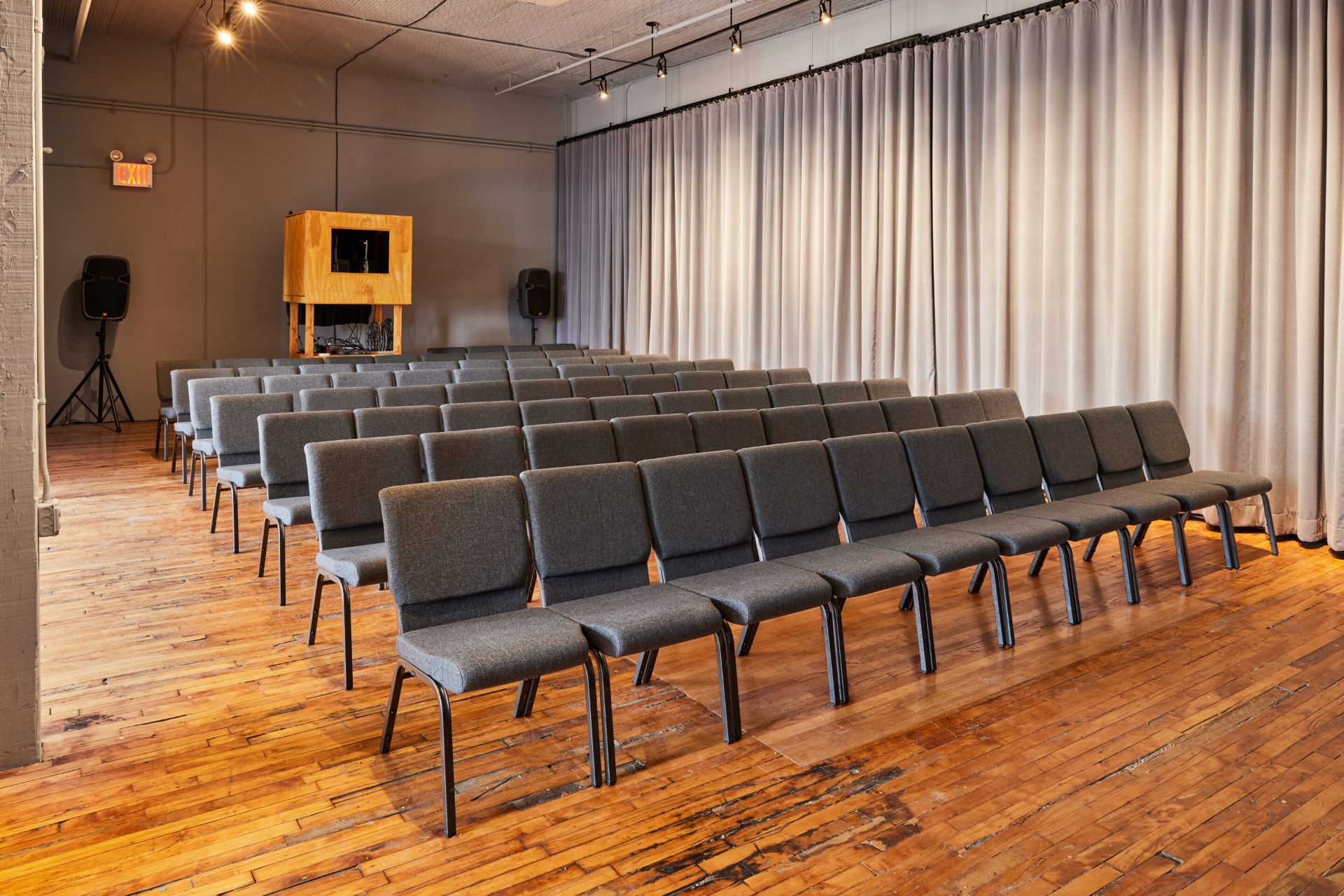 Casa Kino Event Space with rows of chairs and projector Casa Kino Event Space with rows of chairs and projector