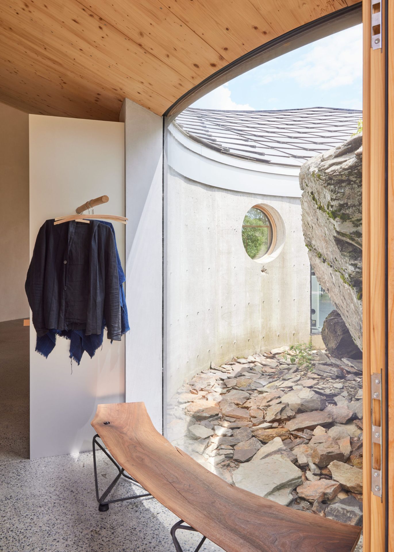 31 Casa Cometa Space Rental Interior Entryway vertical with mudroom and hanging clothes and wooden bench and view of the rock 31 Casa Cometa Space Rental Interior Entryway vertical with mudroom and hanging clothes and wooden bench and view of the rock