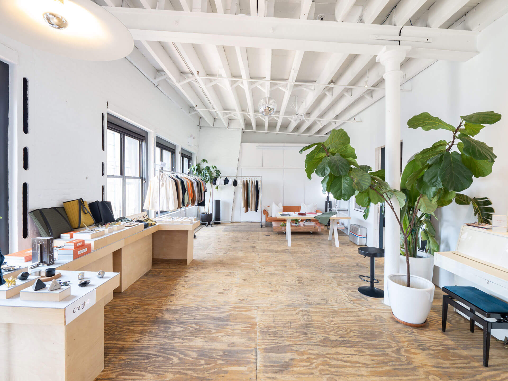 casa janka fashion showroom space rental_nyc loft in little italy white studio with high ceilings clothing racks accessories display casa janka fashion showroom space rental_nyc loft in little italy white studio with high ceilings clothing racks accessories display