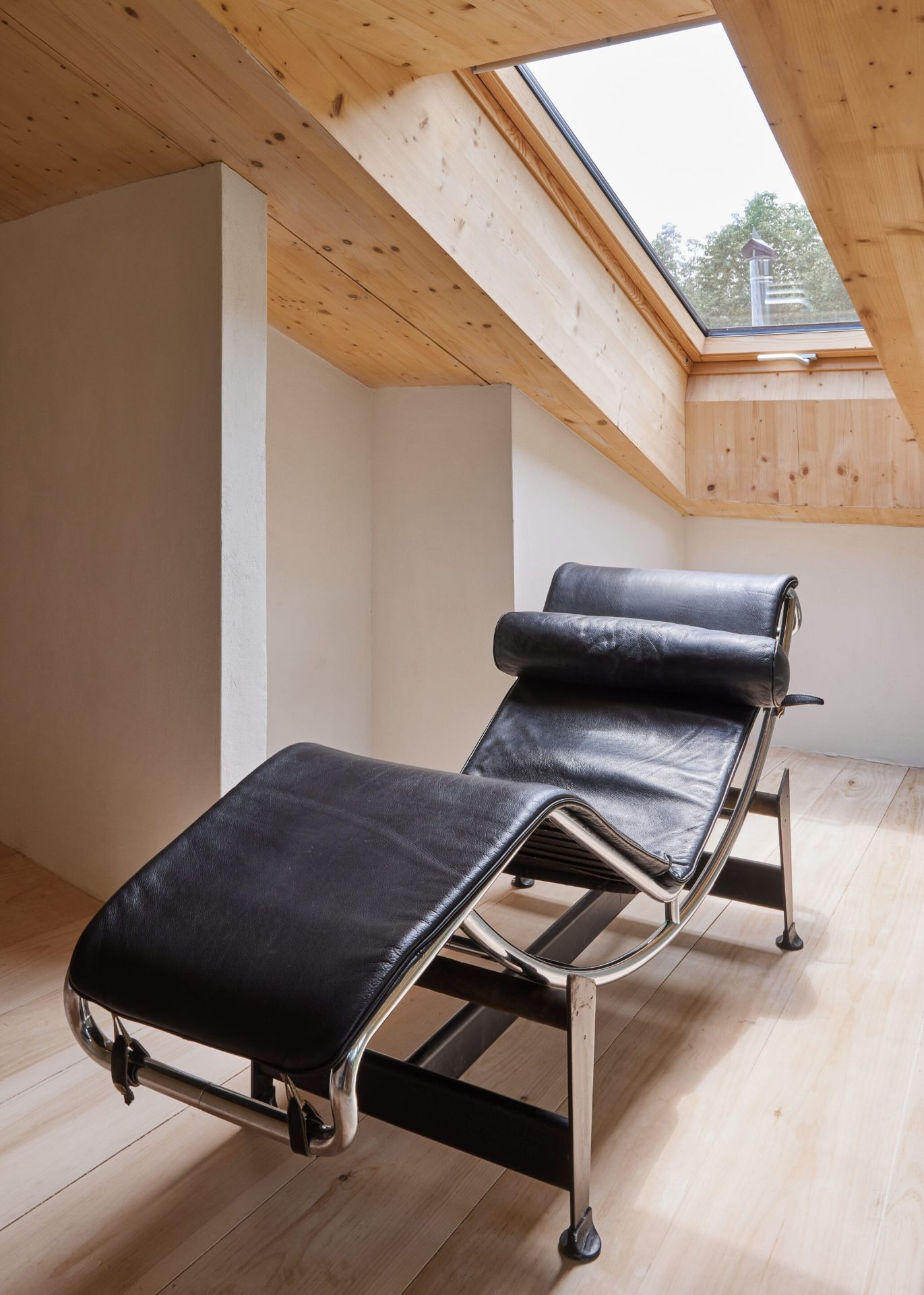 14 Casa Cometa Space Rental Interior Guest Bedroom Loft Suite vertical with vintage le corbusier LC4 lounge chair and skylight